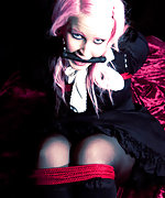 Pink-haired beauty roped and bit-gagged